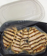 Tray packed, lower sodium flame broiled chicken breasts.